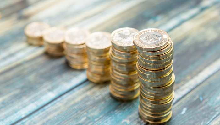 Stacks of pound coins gradually getting bigger