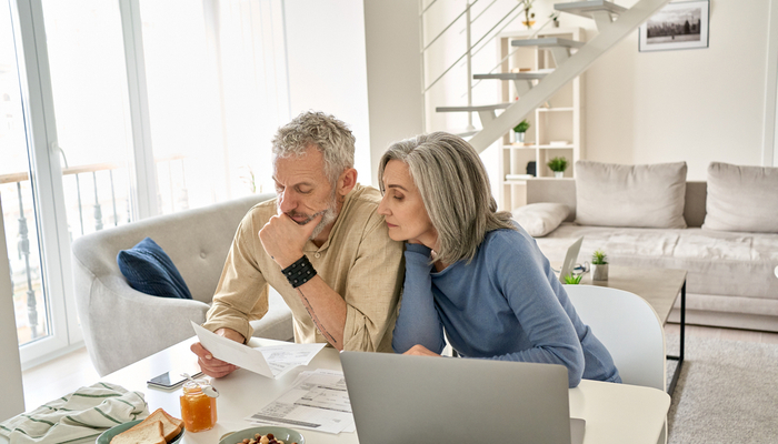 A couple reviewing paperwork together.