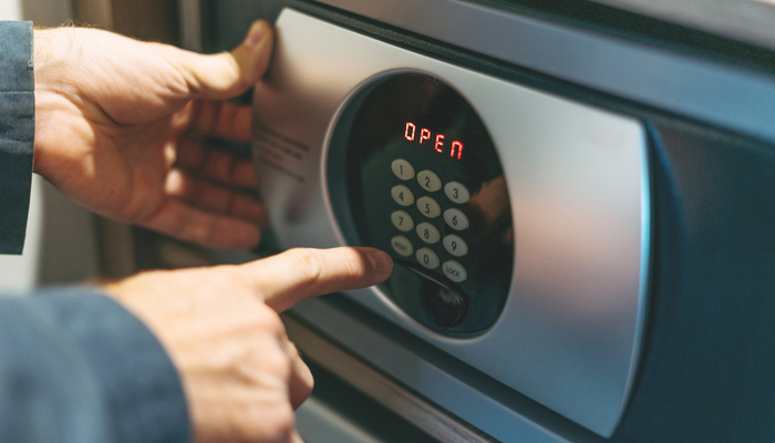 Someone opening a safe.