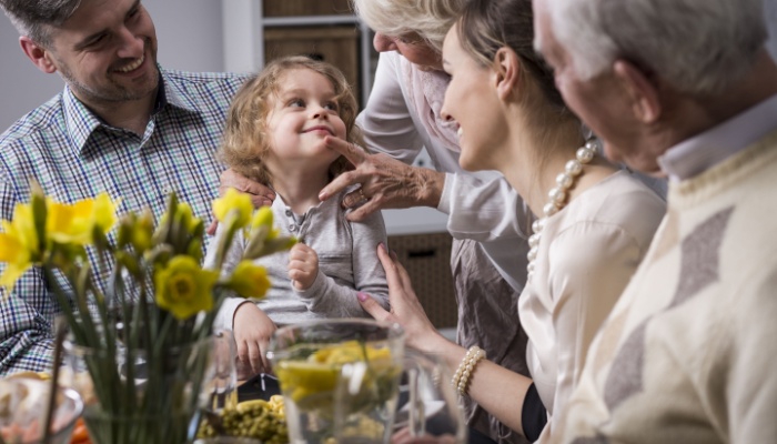 Multi-generation family having dinner together.