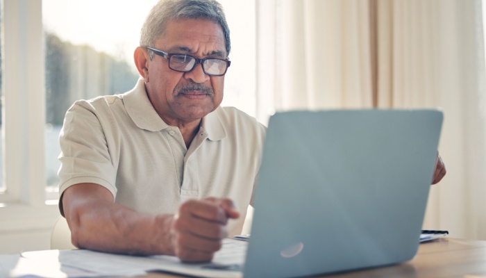A man using a laptop.
