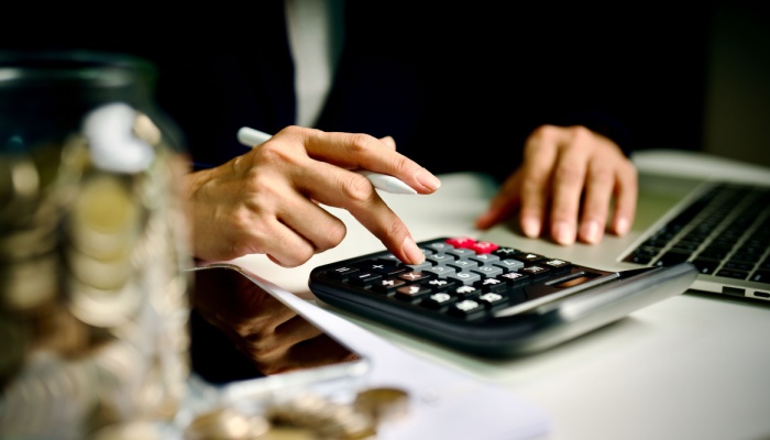 A person using a calculator.